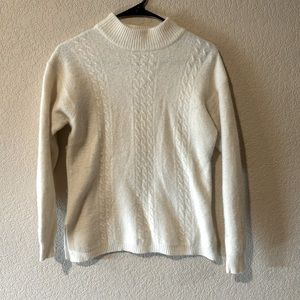 SK&Company size large. Lambs wool, angora rabbit hair, and nylon.